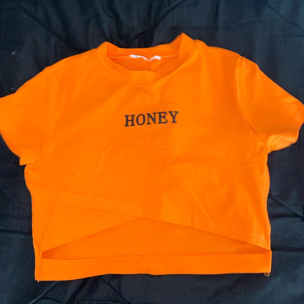 Orange crop top  that says honey